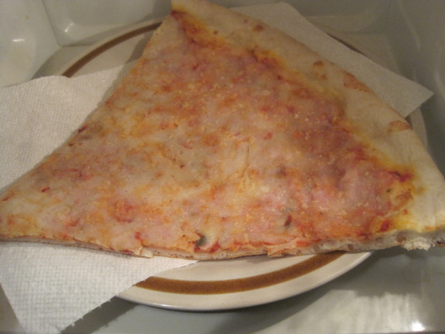 Microwave catering leftover pizza slice